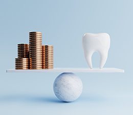 a scale balancing coins and a single tooth