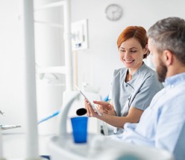 a patient discussing the cost of cosmetic dentistry