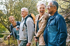 Dentures patient in Waterbury talking with friends 