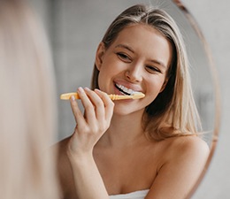 Woman brushing her teeth
