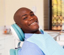 Man smiling after getting dental implants in Waterbury