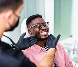 Man smiling at the dentist