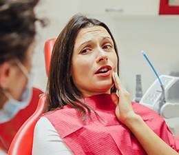 A woman getting a root canal from her dentist