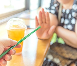 Woman rejecting a straw