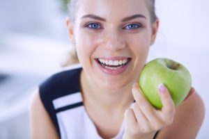 woman holding an apple