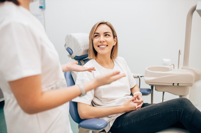 A woman learning about retreatment of a root canal in Waterbury.