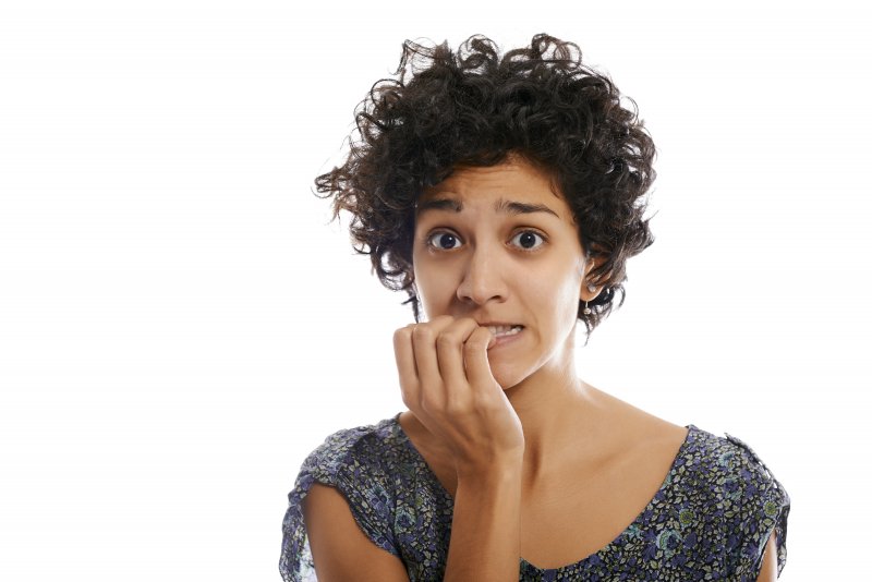 woman biting her nails