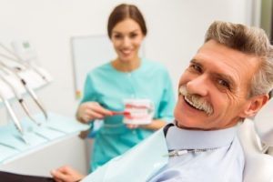Older man at dentist smiling
