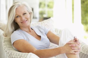 Older woman with dental implants smiling