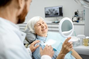 Woman in dental chair for dentures