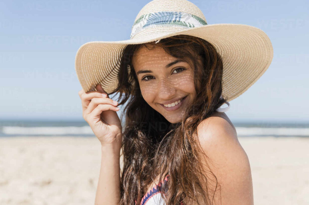 person smiling on the beach