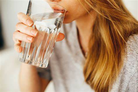 person drinking fluoride in drinking water