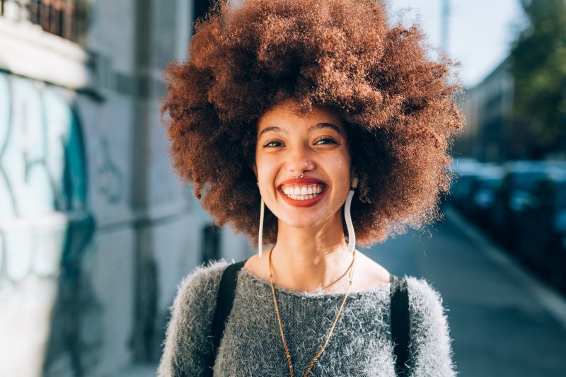 person with dental implants smiling